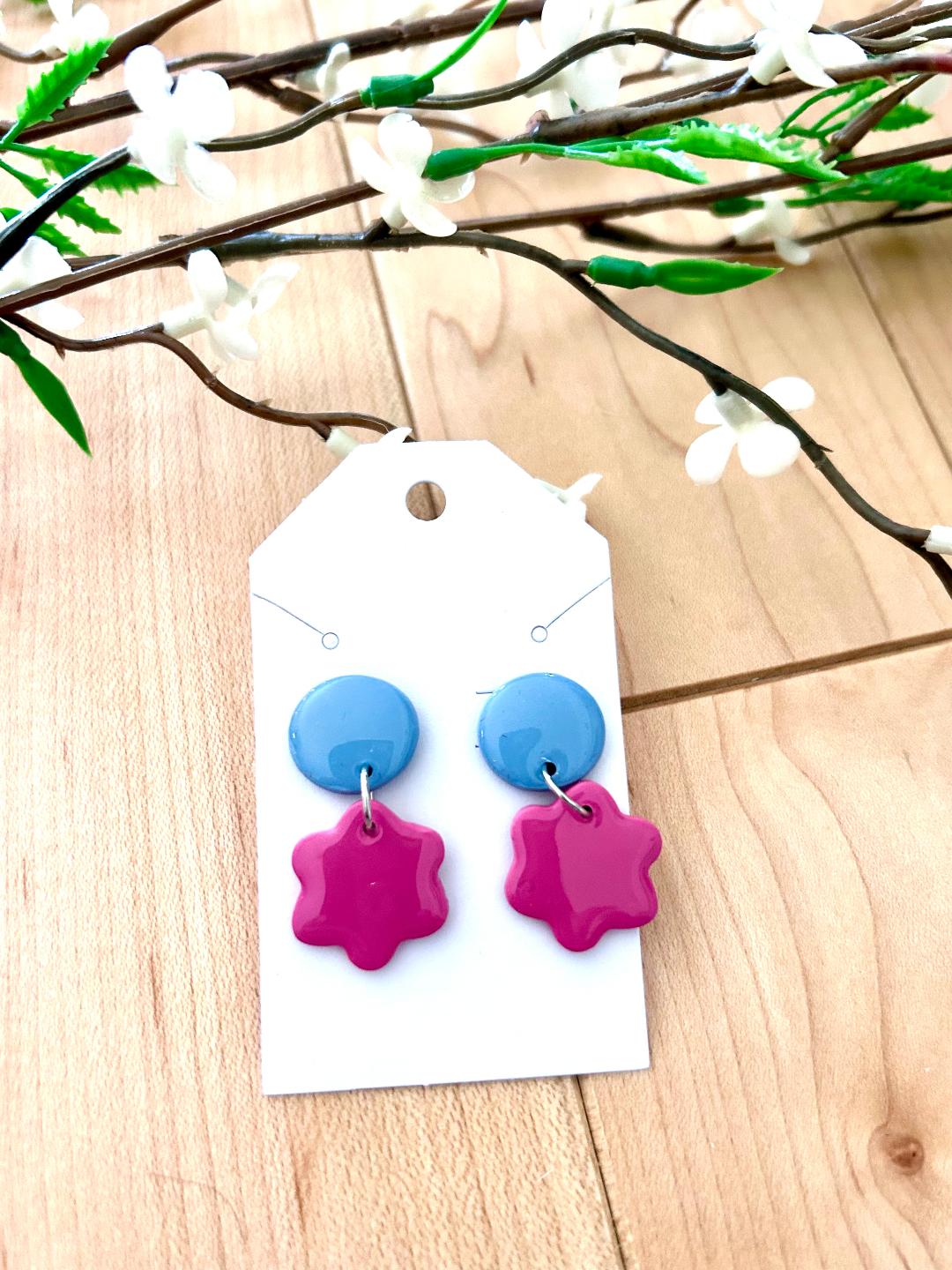 Small flower dangle earrings on a dot