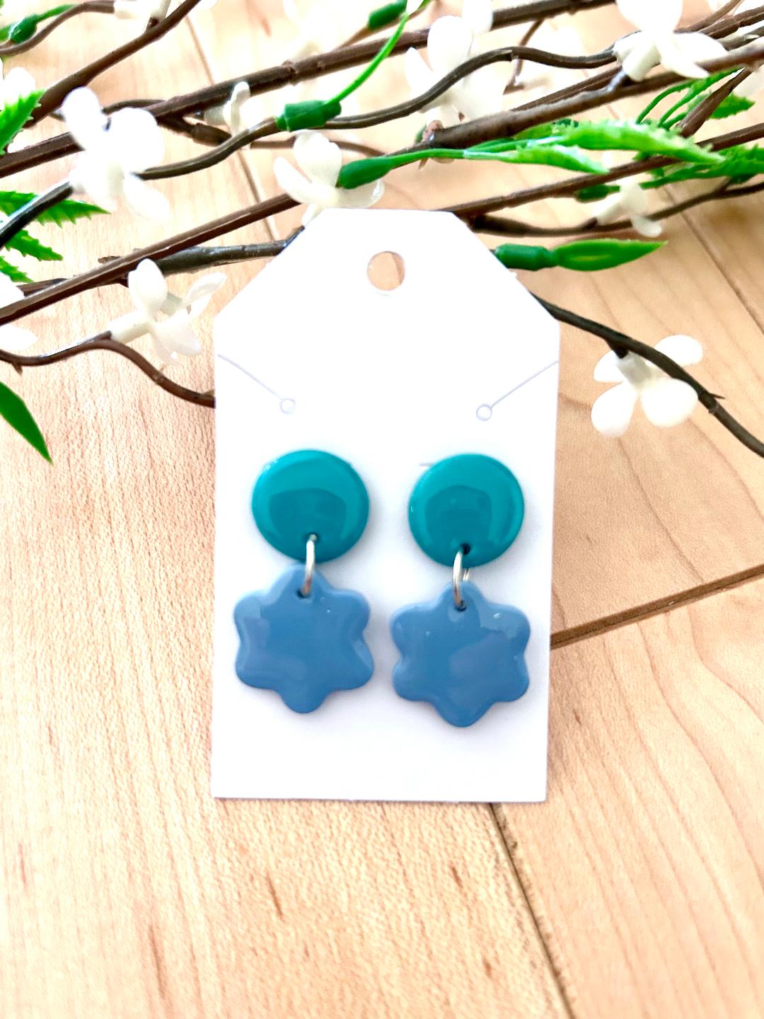 Small flower dangle earrings on a dot