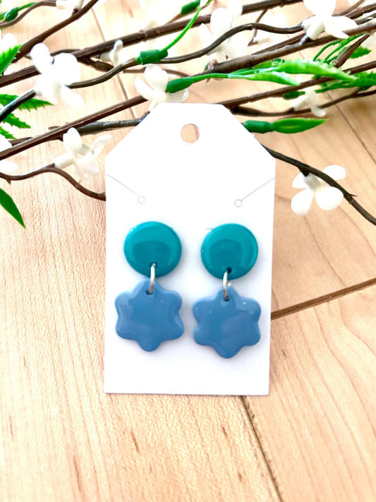 Small flower dangle earrings on a dot